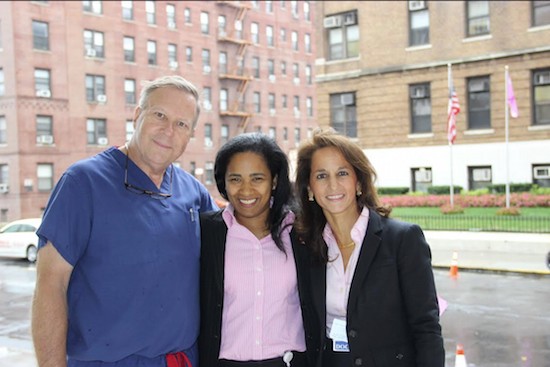 Dr. Patrick Borgen chair of surgery and director of the Maimonides Breast Center Dr. Donna Marie Manasseh chief of breast surgery and Dr. Christina Giuliano chief of breast imaging stand outside the hospital on 10th Avenue after the pink flag was