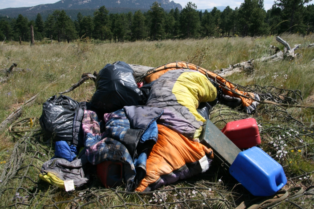 Law enforcement officials removed more than 3,000 pounds of pipe pesticides other liquids camping gear and trash from an illegal marijuana grow site in the Pike National Forest Wednesday.  U.S. Forest Service