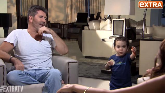 Simon Cowell's son Eric Cowell crashes his dad's interview with Extra