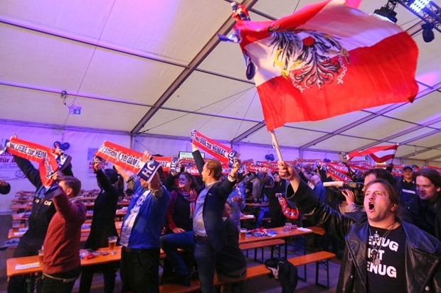 Freedom Party supporters wave flags