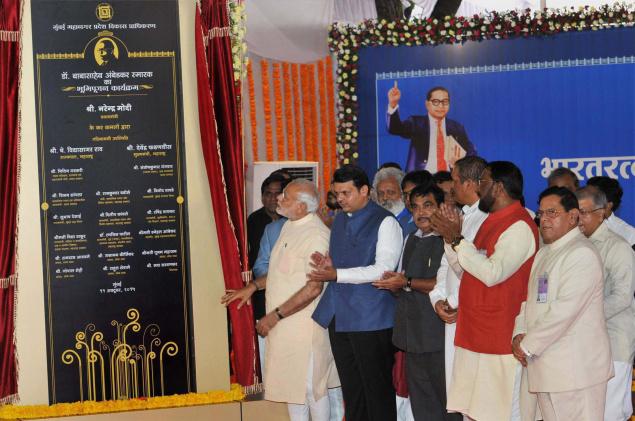 Prime Minister Narendra Modi unveiling a plaque to mark the laying of foundation stone of Dr. Babasaheb Ambedkar Memorial at Indu Mills Compound Mumbai