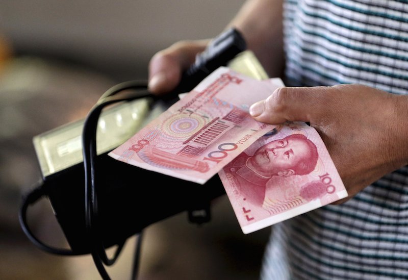 China Caps Overseas Cash Withdrawals