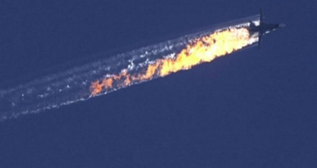 A Russian warplane goes down in flames yesterday