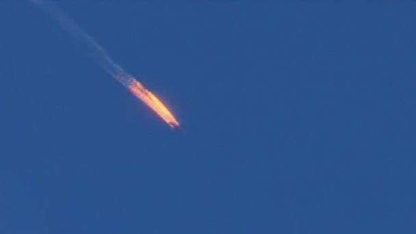 A Russian warplane on fire before crashing in Turkey after being shot down