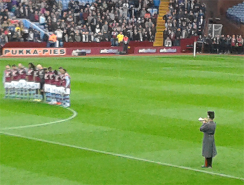 A bugler plays The Last Post before the Aston Villa v Man City game on Remembrance Sunday