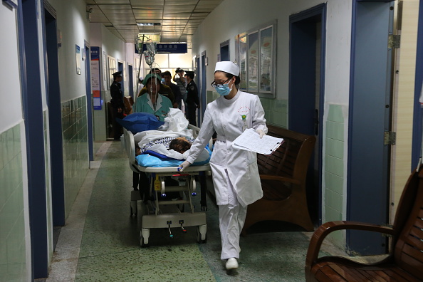 A nurse wheels a patient along a hospital hallway in Nanning Guangxi Province on Nov. 27 2014