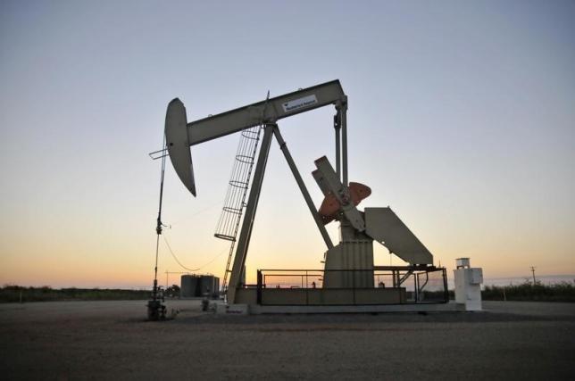 A pump jack operates at a well site leased by Devon Energy Production Company near Guthrie Oklahoma