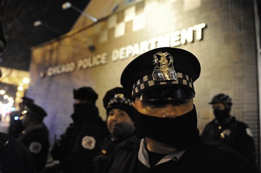 Chicago police officers line up outside the District 1 central headquarters at 17th and State streets Tuesday Nov. 24 2015 during a protest for 17-year-old Laquan McDonald who was fatally shot and killed in October 2014 in Chicago. Chicago police Off