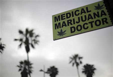 A sign advertises a medical marijuana dispensary on Venice Beach in Los Angeles California