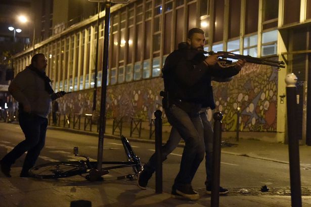 Policemen patrol near'Le carillon restaurant one of the site of the attacks in Paris after a crowd movement that led to a panic