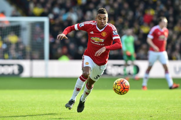 Jesse Lingard runs with the ball