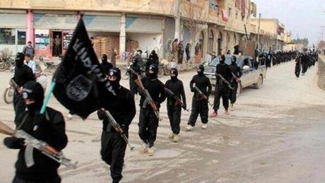 An undated image shows ISIS fighters marching in Raqqa Syria