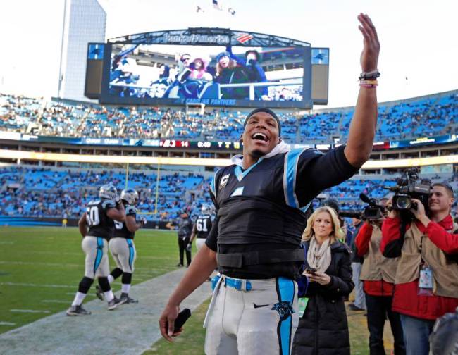 Cam Newton feels the love from the home crowd after his career-best five touchdown passes torched Washington