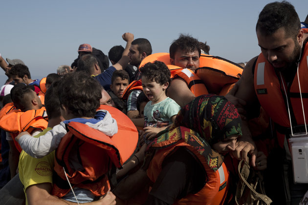 Syrian refugees arrive on the shores of a Greek island