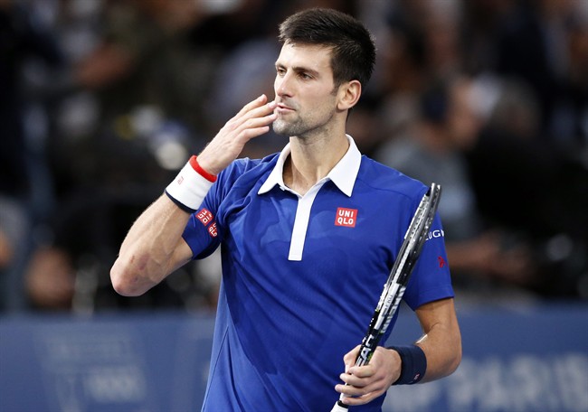 Serbia's Novak Djokovic blows a kiss on the match point to win Britain's Andy Murrray during their final match of the BNP Masters tennis tournament at the Paris Bercy Arena in Paris France Sunday Nov. 8 2015. Djokovic wins 6-2 6-4. (AP