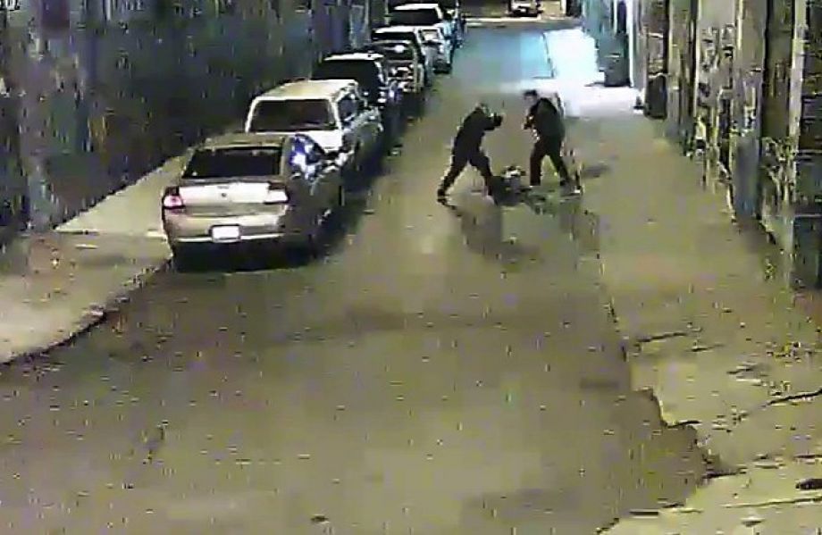 Two Alameda County Sheriff deputies are shown beating a man on a street in San Francisco's Mission District in a video screen grab provided by the San Francisco Public Defender's Office