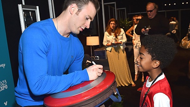 Cap signs an autograph