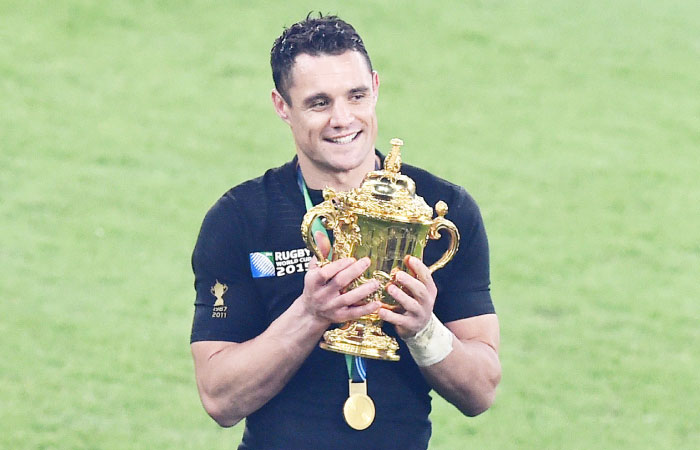 New Zealand’s fly half Dan Carter holds the Webb Ellis Cup as he celebrates winning the final of the 2015 Rugby World Cup against Australia at Twickenham Stadium south west London Saturday. — AFP