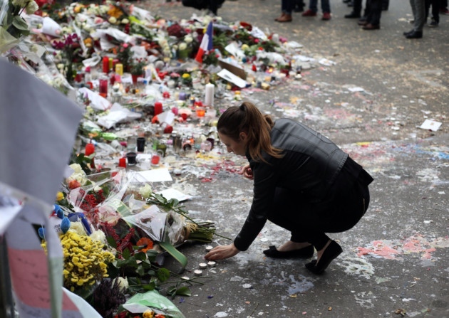 Floral tributes continue to be left near the Bataclan concert hall in Paris following the terrorist attacks on Friday evening