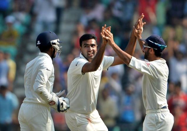 India's Ravichandran Ashwin celebrates with teammates after taking the wicket of South Africa's AB de Villiers on the third day of the third cricket Test match between India and South Africa at Vidarbha Cricket Association Stadium on Friday