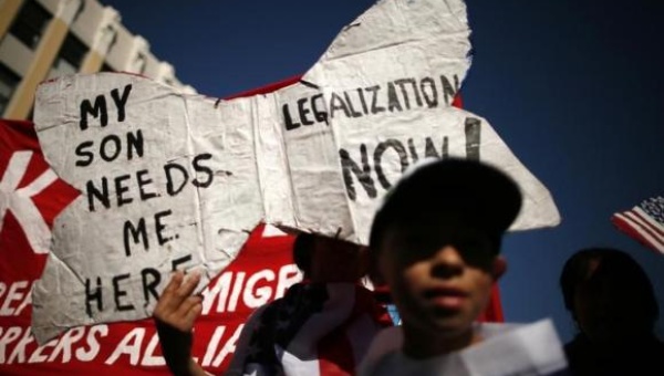 An undocumented immigrant who lived in the U.S. for 26 years marches to demand immigration reform in Los Angeles