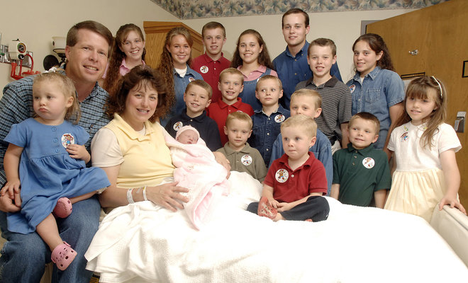 Michelle Duggar left is surrounded by her children and husband Jim Bob second from left after the birth of her 17th child in Rogers Ark. From the rubble of TLC's canceled'19 Kids and Counting now rises'Jill