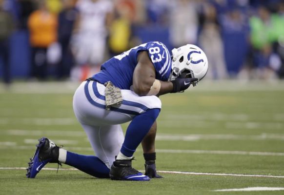 Indianapolis Colts Dwayne Allen reacts after getting