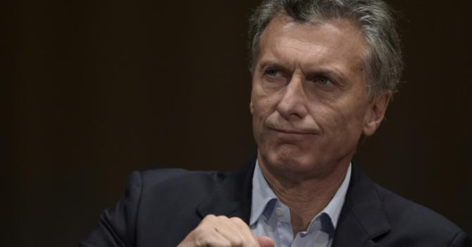 Argentina's president elect Mauricio Macri listens during a press conference in Buenos Aires