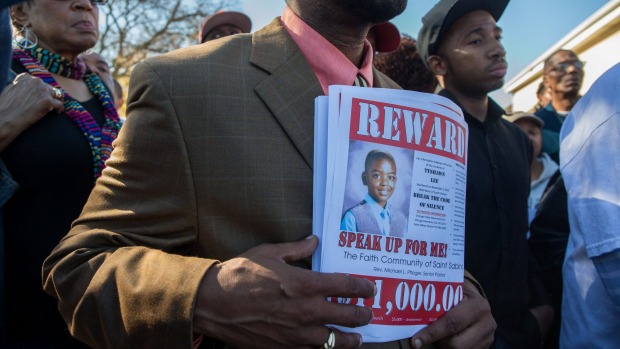 The Saint Sabina church and other area churches offer a reward at the site where Tyshawn Lee 9 was fatally shot in Chicago's Gresham neighborhood on Monday