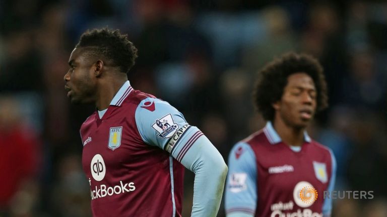 Aston Villa's Carlos Sanchez and Micah Richards look dejected