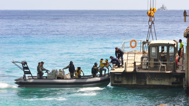 Suspected asylum seekers arrive at Christmas Island after being intercepted by the Australian Navy. New Zealand has been urged to speak out against Australia's treatment of asylum seekers during an official UN review