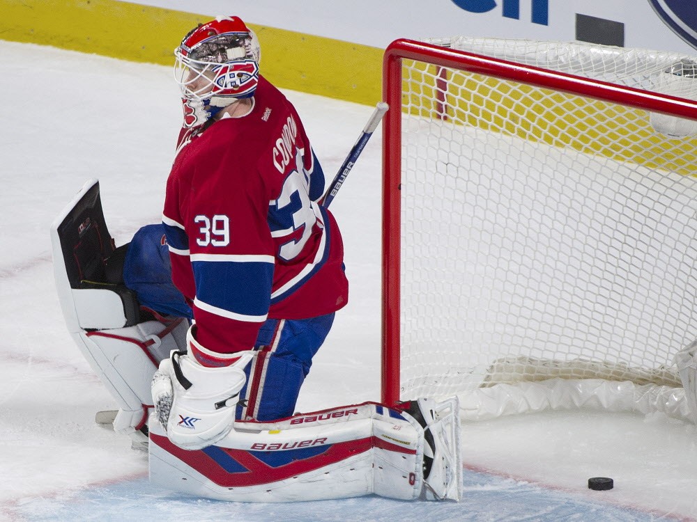 Canadiens goaltender Mike Condon is scored on by Colorado Avalanche's Nathan Mac Kinnon during first period NHL hockey action in Montreal Saturday