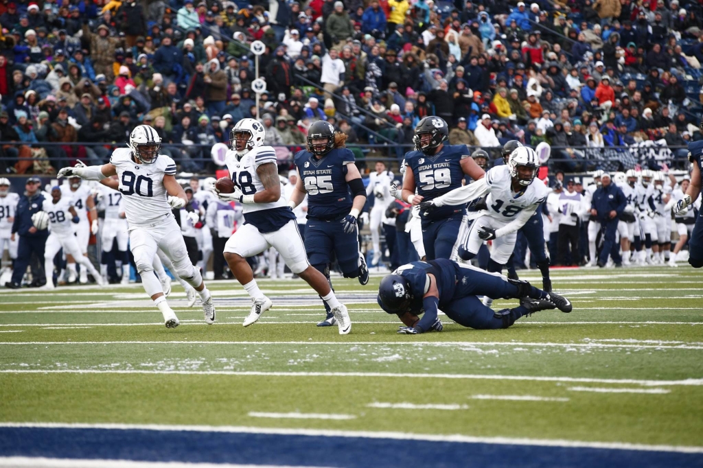 BYU lineman Tomasi Lauile scores a defensive touchdown for the Cougars BYU at Utah State Logan Utah Nov. 28 2015