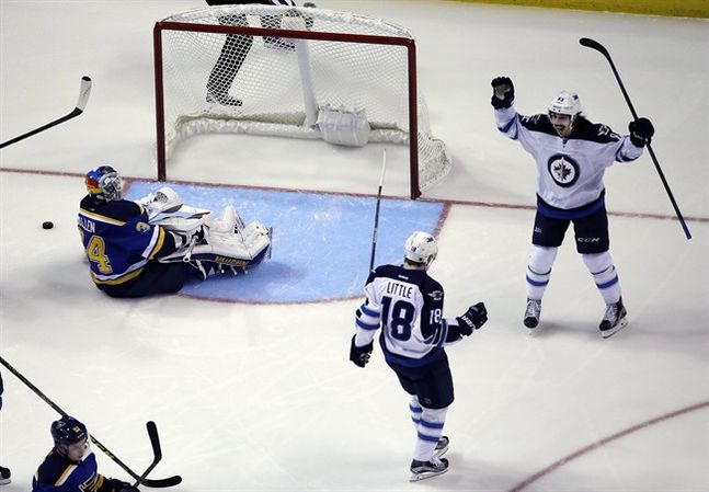 Winnipeg Jets Bryan Little is congratulated by teammate Mathieu Perreault right after scoring past St. Louis Blues goalie Jake Allen left during the second period of an NHL hockey game Monday Nov. 16 2015 in St. Louis. (AP