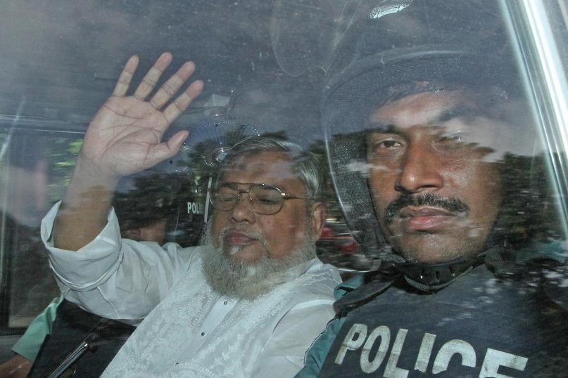 17 2013 shows secretary general of Jamaat e Islam Ali Ahsan Mohammad Mujahid waving from a police vehicle as he is transported to the central jail after a court verdict in Dhaka. Bangladesh's highest court upholds the