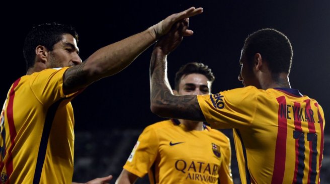 Barcelona forward Neymar celebrates with teammate Luis Suarez after scoring a goal during the Spanish league football match Getafe CF vs FC Barcelona at the Coliseum Alfonso Perez stadium in Getafe. AFP