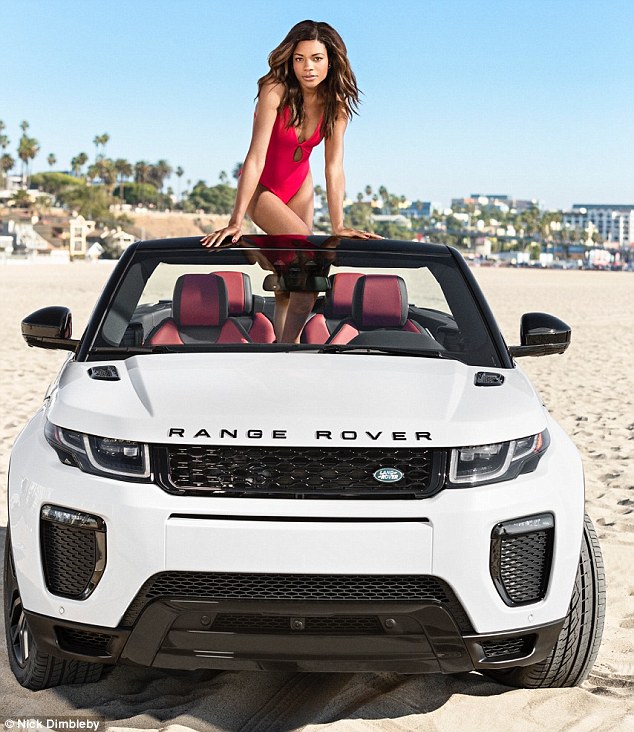 Beach babe Naomie Harris slipped into a bright pink plunging swimsuit to shoot a Range Rover campaign in Santa Monica California on Sunday