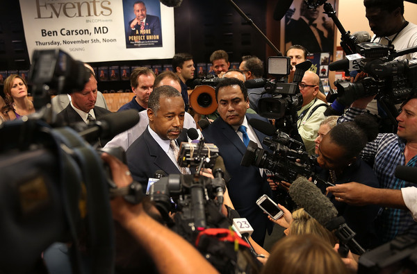 Republican presidential candidate Ben Carson speaks to the media during a stop to sign his book at a Barnes and Noble store