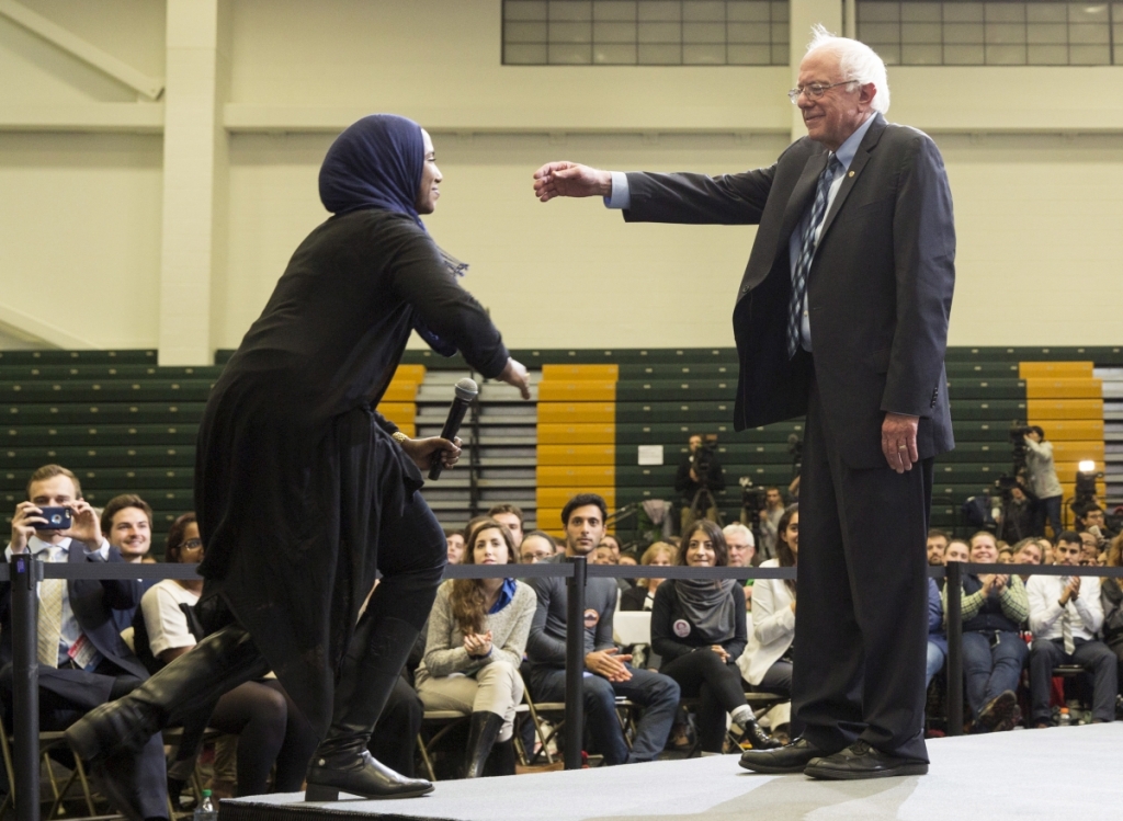 Bernie Sanders greets Remaz Abdelgader during a town hall meeting with students at George Mason University in Fairfax