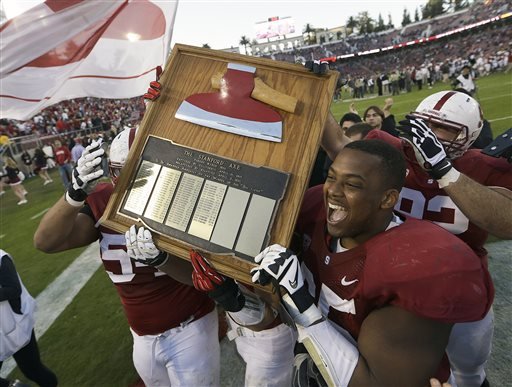 Stanford players celebrate with The Stanford Axe after a win over California in an NCAA college football game in Stanford Calif. In five years at California safety Stefan Mc Clure has not laid his hands on the