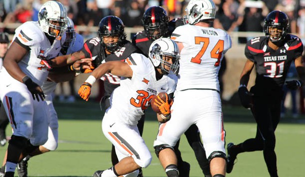 Oct 31 2015 Lubbock TX USA Oklahoma State Cowboys running back Raymond Taylor rushes against the Texas Tech Red Raiders in the second half at Jones AT&T Stadium. Oklahoma State defeated Texas Tech 70-53. Mandatory Credit Michael C. Johnson-US