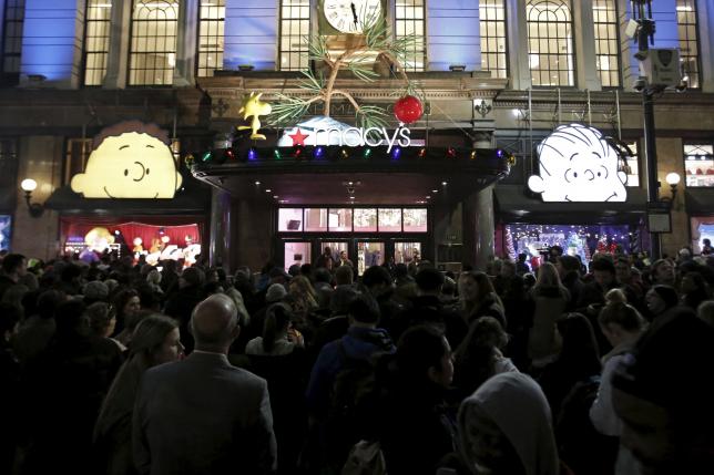 Shoppers wait to enter Macy's Herald Square store during the early opening of the Black Friday sales in the Manhattan borough of New York