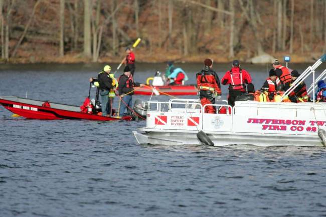 Emergency crews from multiple agencies work the scene at White Meadow Lake. The body of the missing canoeist was found the morning of Nov. 24