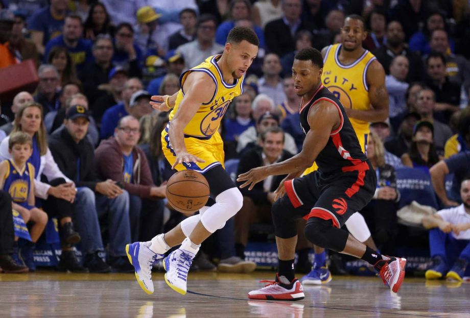 Golden State Warriors Stephen Curry left drives the ball against Toronto Raptors Kyle Lowry during the first half of an NBA basketball game Tuesday Nov. 17 2015 in Oakland Calif