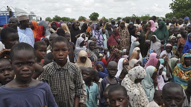 Refugees... civilians flee their homes following an attack by Boko Haram in Bama Nigeri