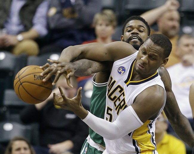 Indiana Pacers Lavoy Allen and Boston Celtics Amir Johnson battle for a loose ball during the second half of an NBA basketball game Wednesday Nov. 4 2015 in Indianapolis. The Pacers won the game 100-98