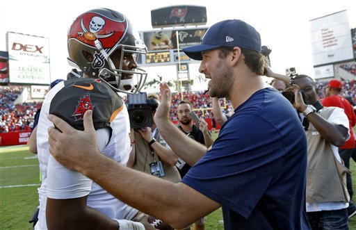 Tampa Bay Buccaneers quarterback Jameis Winston shakes hands with Dallas Cowboys quarterback Tony Romo after the Buccaneers defeated the Cowboys 10-6 during an NFL football game Sunday Nov. 15 2015 in Tampa Fla