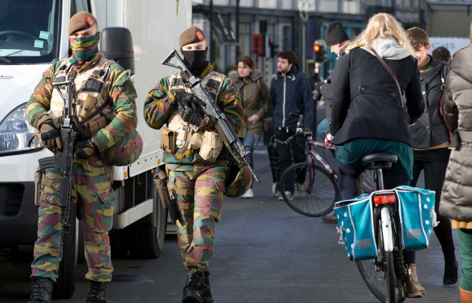 Belgian Army soldiers patrols in the center of Brussels on Monday Nov. 23 2015. The Belgian capital Brussels has entered its third day of lockdown with schools and underground transport shut and more than 1,000 security personnel deployed across the