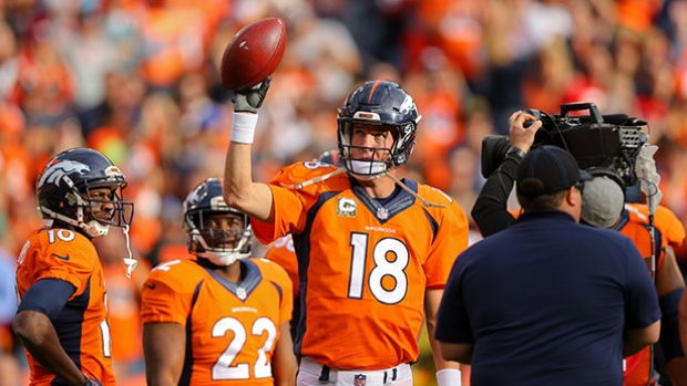 Quarterback Peyton Manning of the Denver Broncos acknowledges the crowd after completing a 4-yards pass to set the all-time career passing yards record during the first quarter against the Kansas City Chiefs on Sunday in Denver