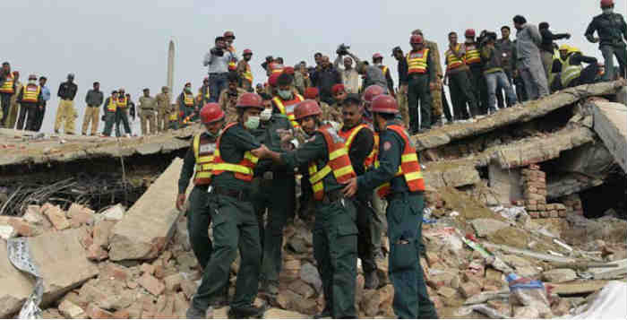 Pakistan factory collapse: At least 10 dead and dozens trapped after roof